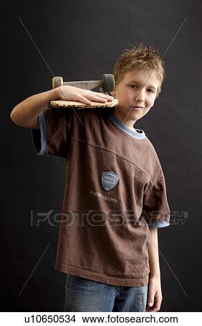 Picture - Boy with skateboard. Fotosearch