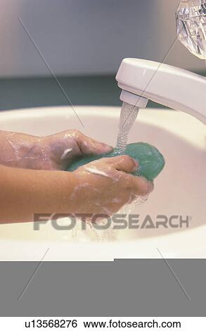 Stock Photograph - Child washing hands. Fotosearch