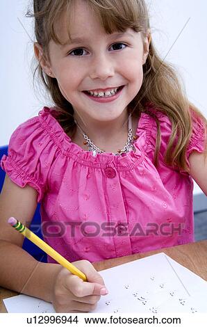 Girl doing homework View Large Photo Image Picture - Girl doing homework. Fotosearch
