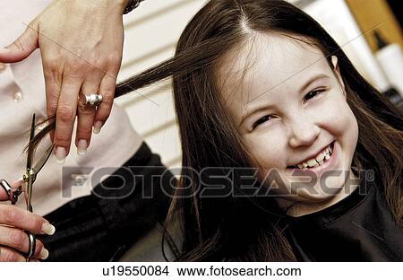 Girl getting her hair cut View Large Photo Image Picture - Girl getting her hair cut. Fotosearch