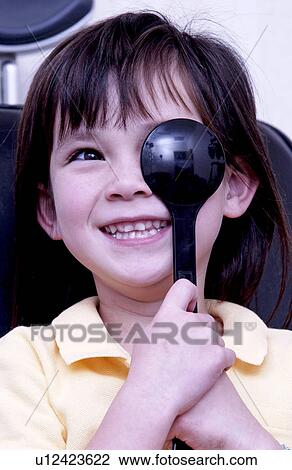 Girl getting vision tested View Large Photo Image Stock Image - Girl getting vision tested. Fotosearch