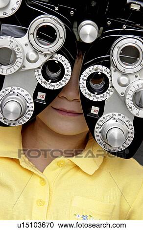 Girl getting vision tested View Large Photo Image Stock Image - Girl getting vision tested. Fotosearch