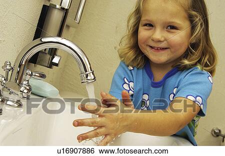 Girl washing her hands View Large Photo Image Stock Photograph - Girl washing her hands. Fotosearch