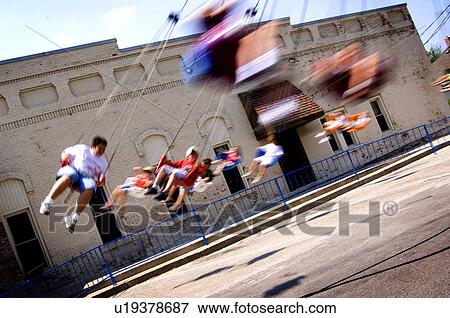 Kids on carnival ride View Large Photo Image Stock Photo - Kids on carnival ride. Fotosearch