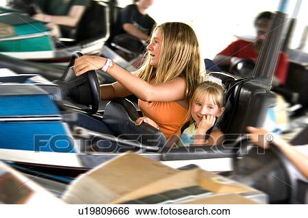Kids on carnival ride View Large Photo Image Stock Photograph - Kids on carnival ride. Fotosearch