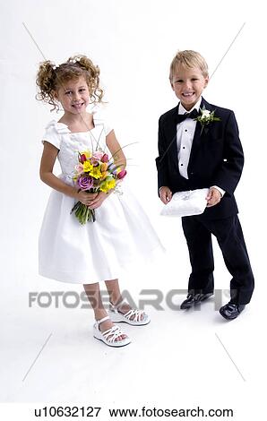 Ring bearer and flower girl View Large Photo Image Stock Photo - Ring bearer and flower girl. Fotosearch