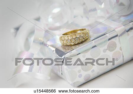 Stock Photograph - Ring with gift. Fotosearch