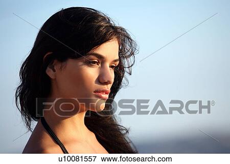 Stock Photo - Closeup of young woman in bathing suit. Fotosearch