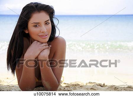 Picture - Closeup of young woman on beach. Fotosearch