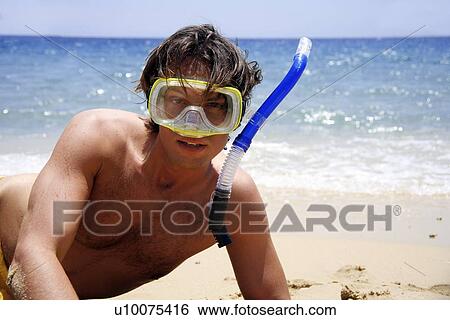 Man on beach with scuba mask View Large Photo Image Stock Photograph - Man on beach with scuba mask. Fotosearch
