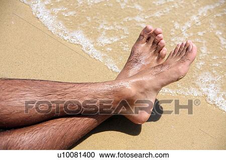 Man's bare feet on sand View Large Photo Image Stock Image - Man's bare feet on sand. Fotosearch