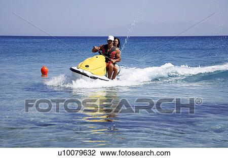 Young couple on jetski View Large Photo Image Stock Image - Young couple on jetski. Fotosearch