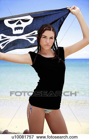 Young woman in bikini holding up skull and bones flag View Large Photo Image Stock Photo - Young woman in bikini holding up skull and bones flag. Fotosearch