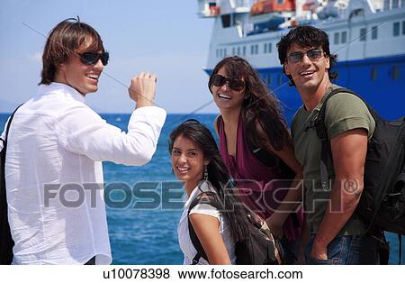 Group of friends in front of ferry View Large Photo Image Stock Photo - Group of friends in front of ferry. Fotosearch