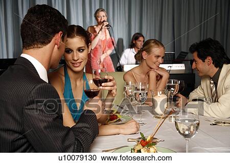 Stock Image - Group of people celebrating . Fotosearch