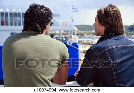 Two men on ferry at dock View Large Photo Image Picture - Two men on ferry at dock . Fotosearch