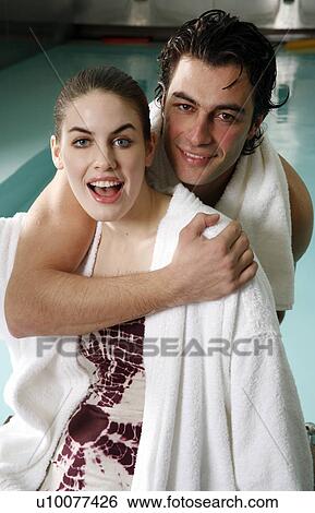 Young couple in a swimming pool at a spa View Large Photo Image Stock Photograph - Young couple in a swimming pool at a spa. Fotosearch