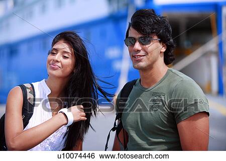 Stock Photograph - Young couple in front of ferry. Fotosearch
