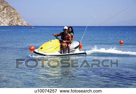 Young couple on jetski View Large Photo Image Stock Photo - Young couple on jetski. Fotosearch