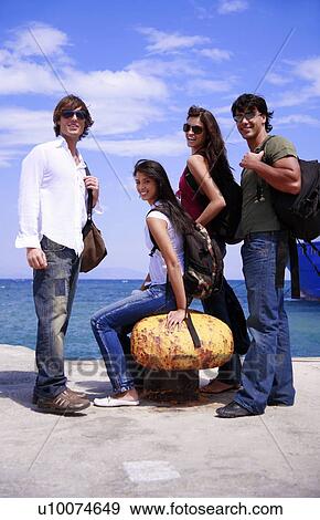 Young people posing at ferry dock View Large Photo Image Stock Photo - Young people posing at ferry dock. Fotosearch