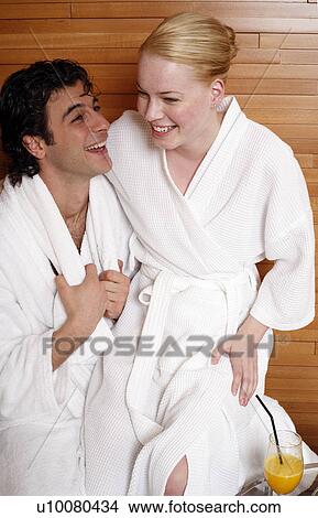 Picture - A couple having a refreshment after a spa treatment. Fotosearch