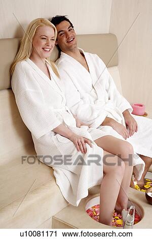 A young couple enjoying a foot bath with rose petals View Large Photo Image Stock Image - A young couple enjoying a foot bath with rose petals. Fotosearch