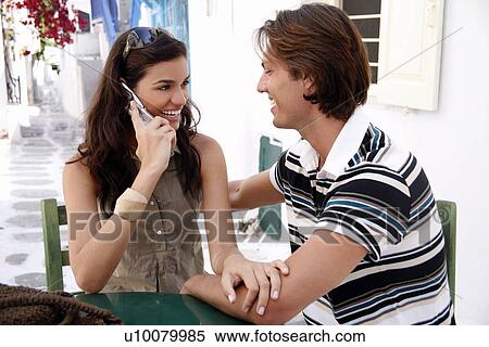 Couple at a table together View Large Photo Image Stock Photography - Couple at a table together. Fotosearch