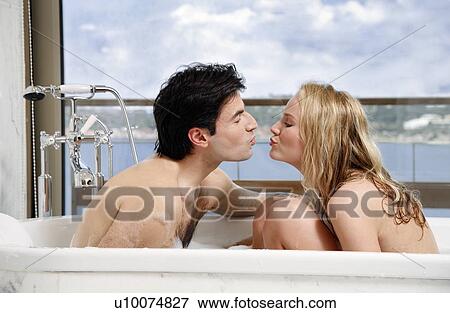 Couple enjoying bubble bath together View Large Photo Image Stock Photo - Couple enjoying bubble bath together. Fotosearch