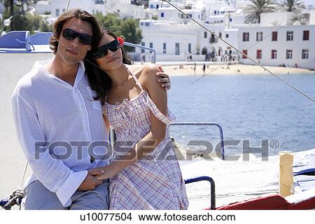 Picture - Couple posing with sea view. Fotosearch