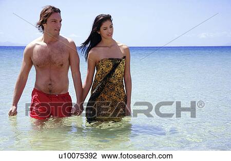 Man and woman holding hands in the water View Large Photo Image Stock Image - Man and woman holding hands in the water. Fotosearch