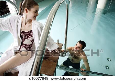 Young couple in a swimming pool at a spa View Large Photo Image Stock Photo - Young couple in a swimming pool at a spa. Fotosearch