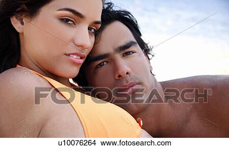 Picture - Young couple on beach. Fotosearch