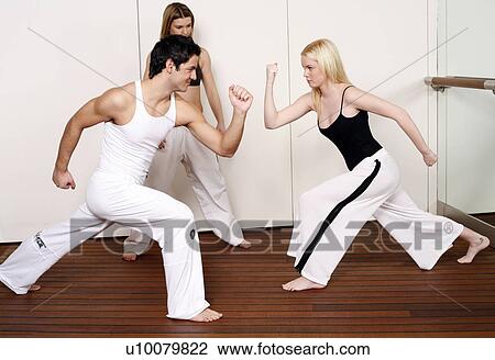 Stock Image - Students practicing Capoeira. Fotosearch