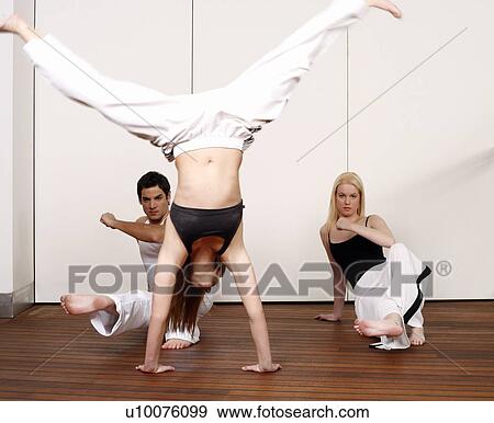 Stock Photo - Students practicing Capoeira. Fotosearch