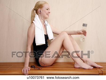 Woman relaxing in locker room after the gym View Large Photo Image Stock Image - Woman relaxing in locker room after the gym. Fotosearch