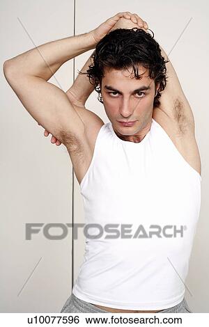Young man stretching View Large Photo Image Stock Photograph - Young man stretching. Fotosearch