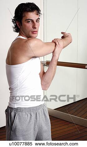 Stock Photography - Young man stretching. Fotosearch