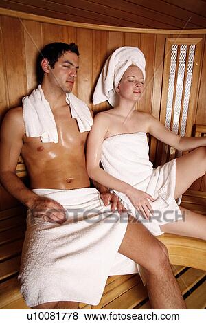 Stock Photo - A couple enjoying a sauna together. Fotosearch