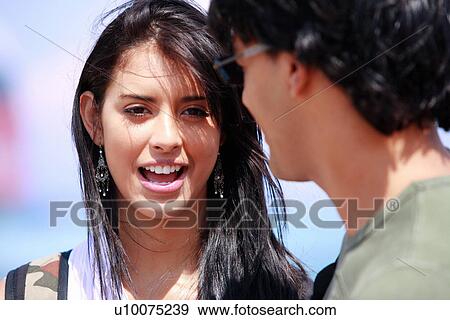 Stock Photo - Closeup of young woman and man. Fotosearch