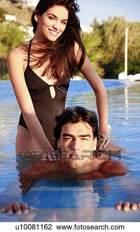 Couple in swimming pool View Large Photo Image Stock Image - Couple in swimming pool. Fotosearch