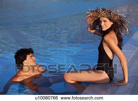 Stock Photograph - Couple in swimming pool. Fotosearch