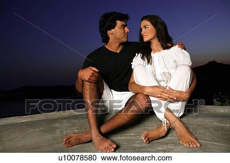 Couple sitting on terrace with a view View Large Photo Image Stock Image - Couple sitting on terrace with a view. Fotosearch