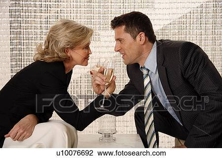 Man and woman sitting in hotel lobby View Large Photo Image Stock Image - Man and woman sitting in hotel lobby. Fotosearch