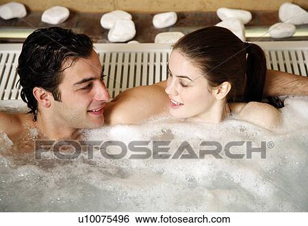 One man with one woman in jacuzzi at a spa View Large Photo Image Stock Photograph - One man with one woman in jacuzzi at a spa. Fotosearch