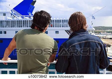 Two men on ferry at dock View Large Photo Image Stock Image - Two men on ferry at dock . Fotosearch