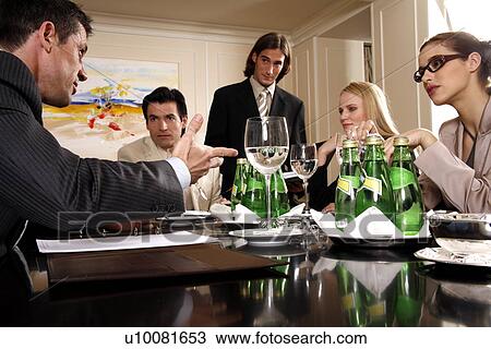 Business people having a meeting View Large Photo Image Stock Image - Business people having a meeting . Fotosearch