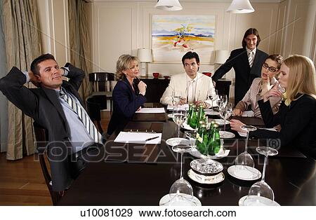 Business people having a meeting View Large Photo Image Stock Photo - Business people having a meeting . Fotosearch
