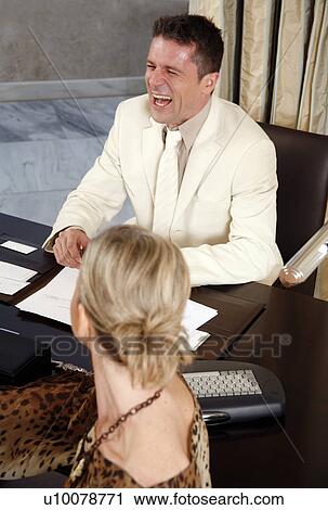 Two business people working in a hotel room View Large Photo Image Stock Image - Two business people working in a hotel room. Fotosearch