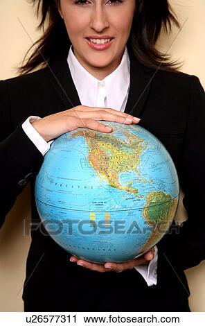 A woman holding a globe View Large Photo Image Stock Image - A woman holding a globe . Fotosearch