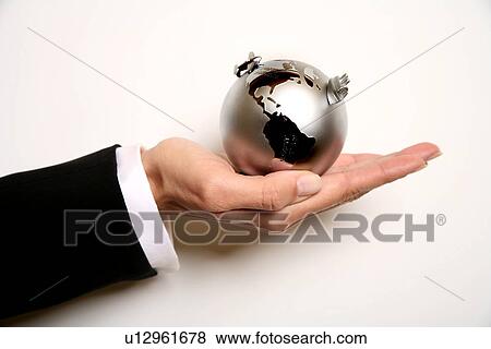 A woman holding a globe View Large Photo Image Stock Photo - A woman holding a globe . Fotosearch